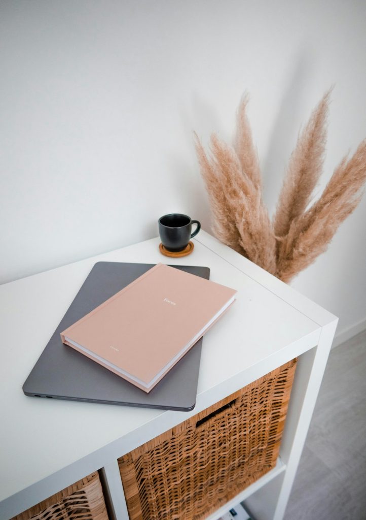 brown-and-black-book-on-white-table-caqhcepas